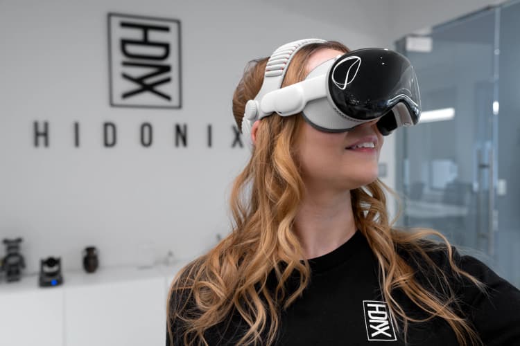 A Hidonix team member explores extended reality technology as part of the company’s expanding work in professional XR