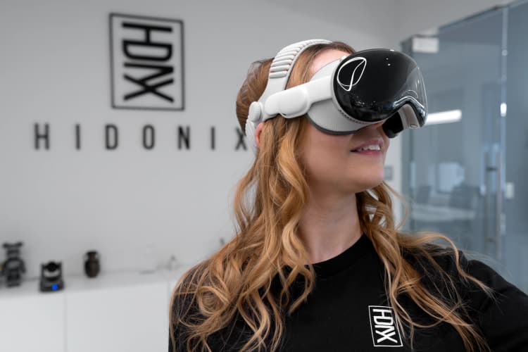 A Hidonix team member explores extended reality technology as part of the company’s expanding work in professional XR